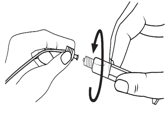 A close-up of a hand holding a plug

Description automatically generated